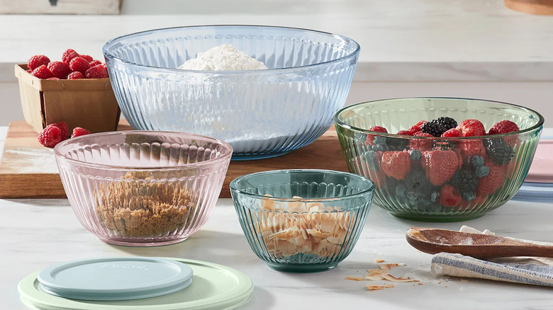 Multi-colored tinted glass bowls filled with various ingredients