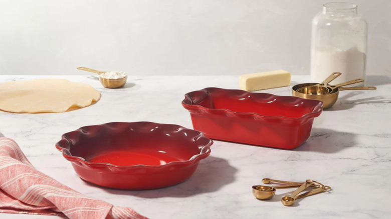 Le Creuset bakeware set including a red fluted pie tin and loaf tin from Macy's