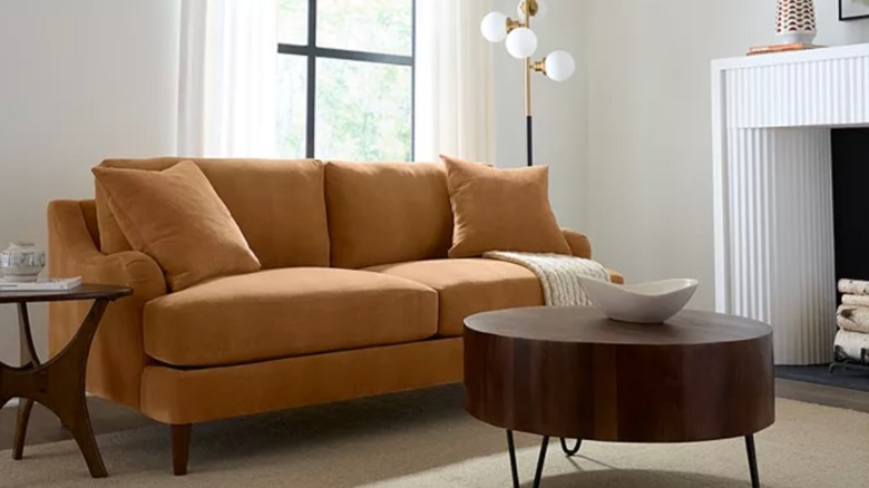 comfortable living room showcasing a yellow Leidie sofa