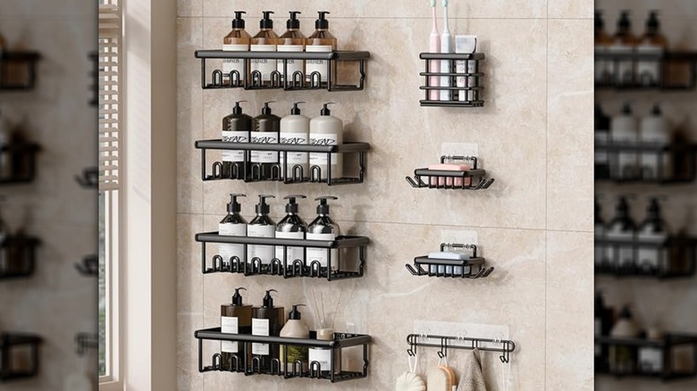 Eight black caddies adhered to a shower wall