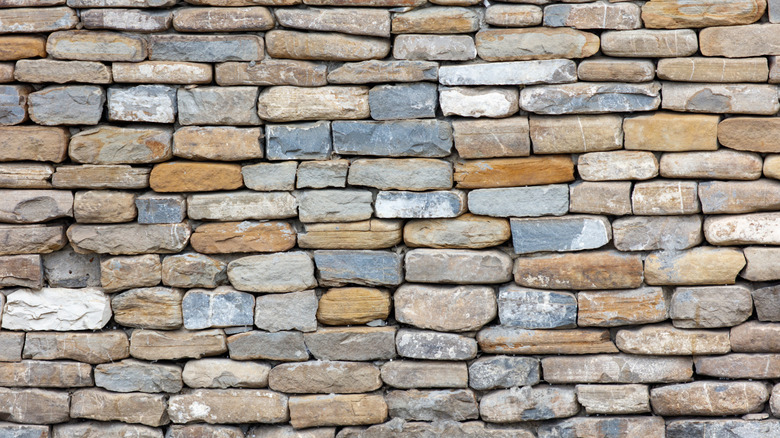 Photo of a granite wall full of colorful bricks