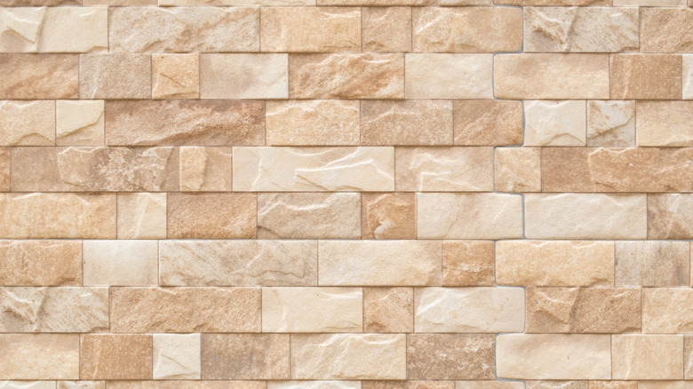 Photo of a marble wall full of split face bricks