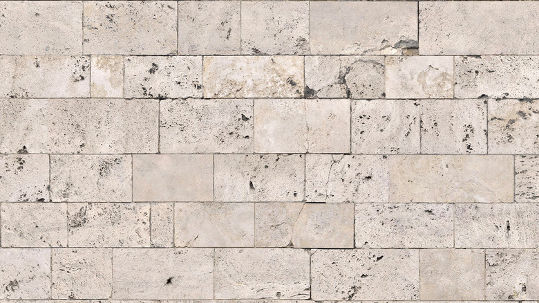 Close up of a light-colored quartzite brick wall