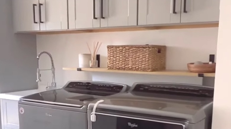 Hanging shelf above washer and dryer