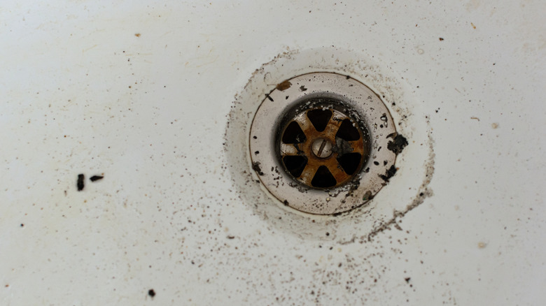Dirty skow running bathroom sink