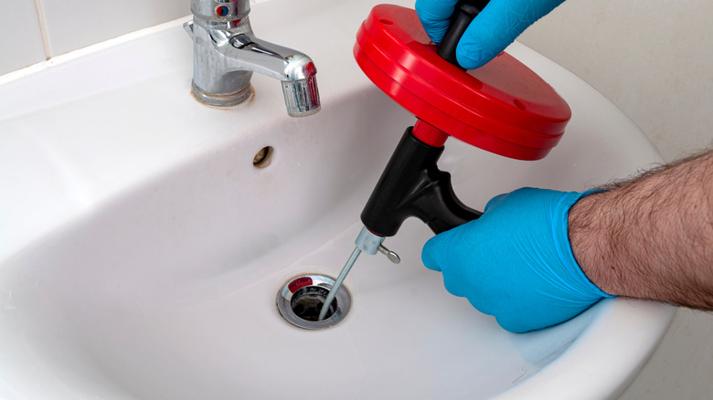 Using a plumbing snake in a bathroom sink