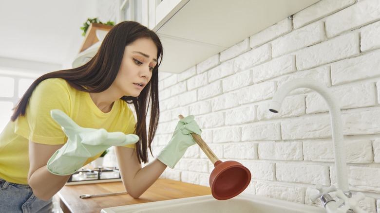 Trying to unclog sink with plunger