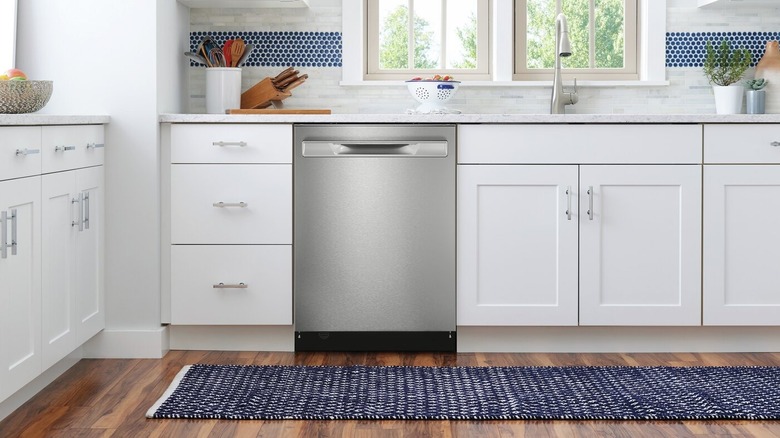 a stainless steel frigidaire dishwasher sparkles in a new kitchen