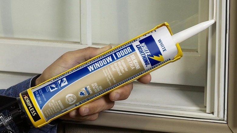 Using White Lightning caulk to weatherproof a window