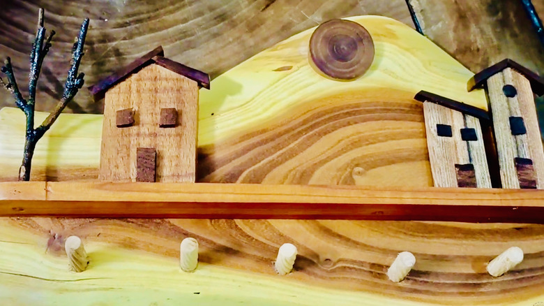 A DIY artistic key rack made from wood scraps is shown