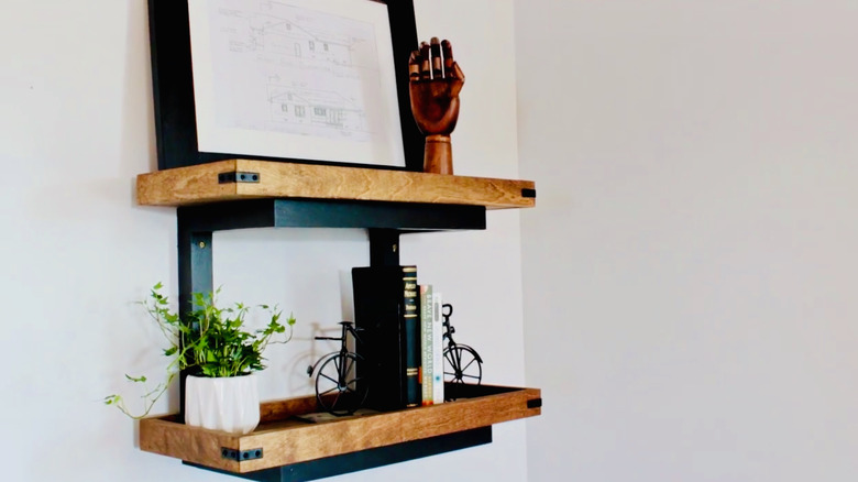 A DIY two-shelf wall unit made from wood scraps