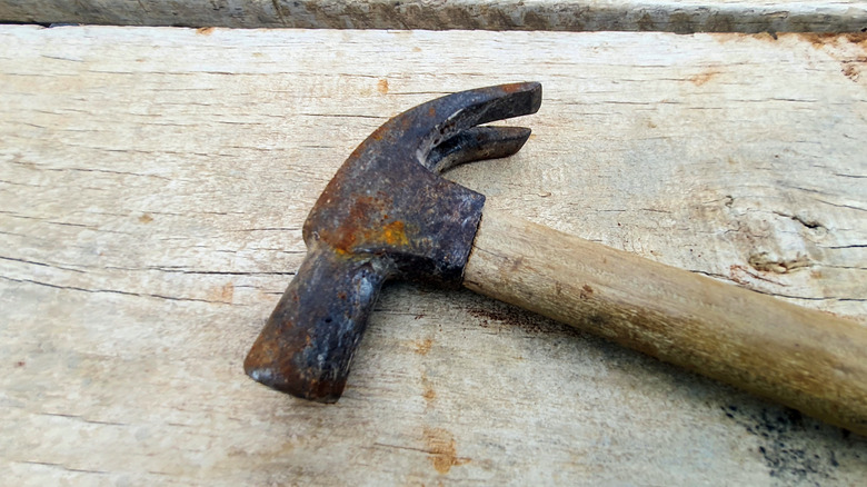 Old hammer with rust on the head