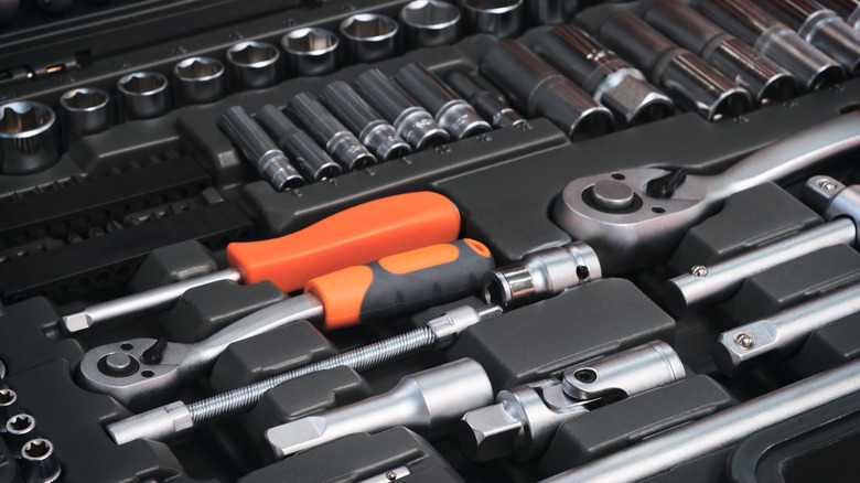 A tool box with compartments designed to hold specific types of tools