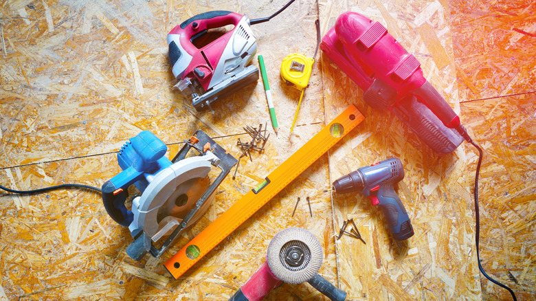 Tools laying out on a piece of plywood
