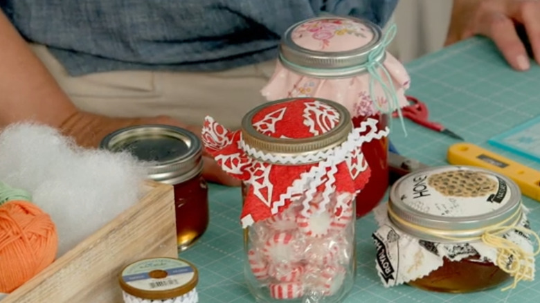 Fabric covers on Mason jars.