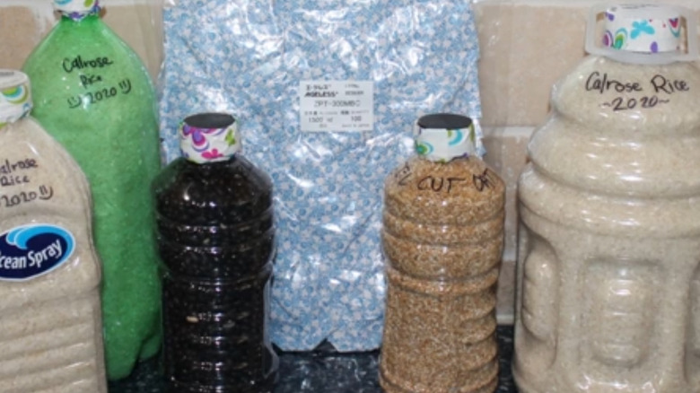 Soda and juice bottles used to store rice.