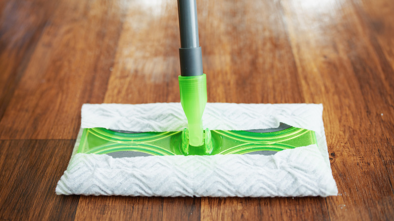 Closeup of a wet mop cleaning the floor