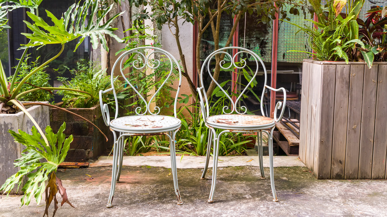 two steel chairs with rust