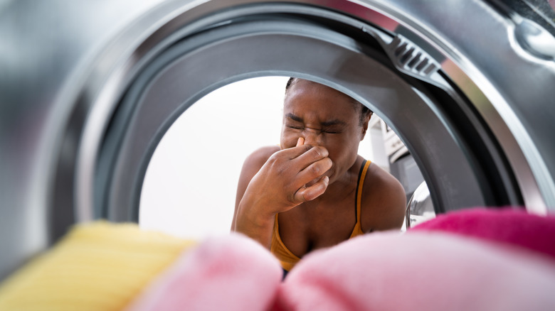 Woman complaining of a smell coming from her washing machine