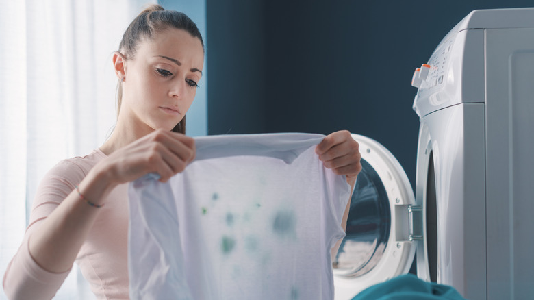 Woman upset that clothes are still dirty