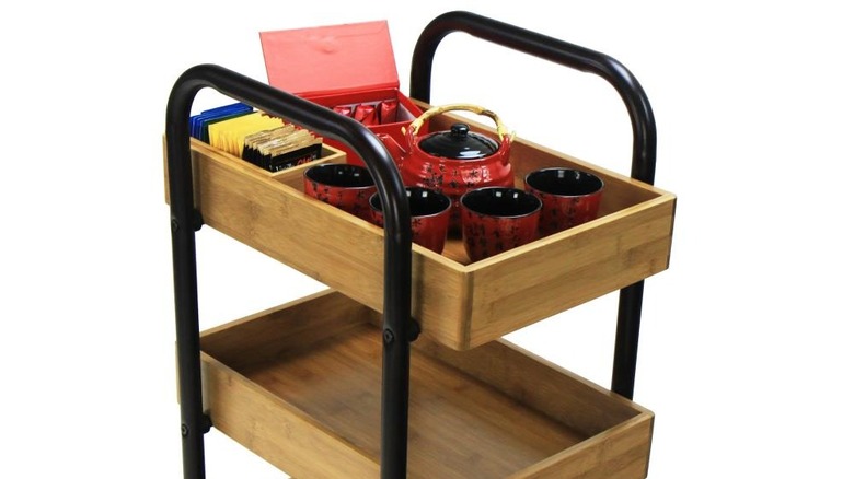 Oceanstar's storage cart with a tea pot and cups on the top shelf