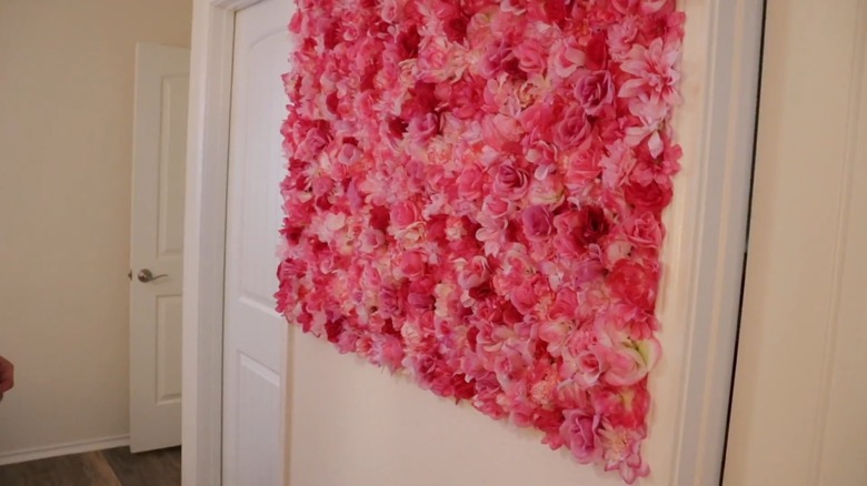 A pink and red flower wall in a home