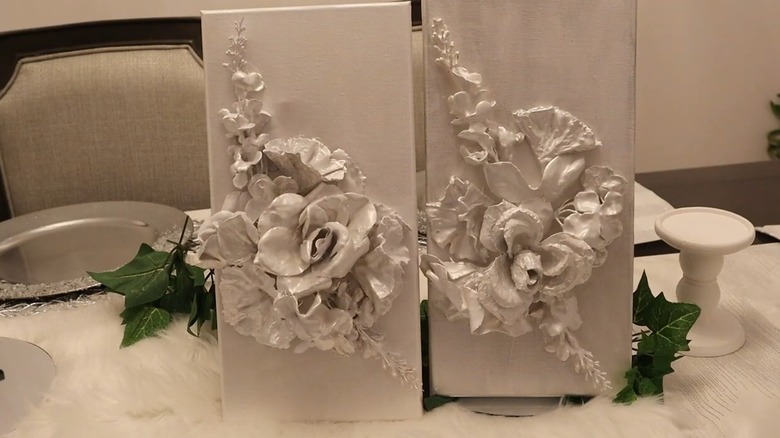 Flowers dipped in plaster of Paris and displayed on a kitchen table