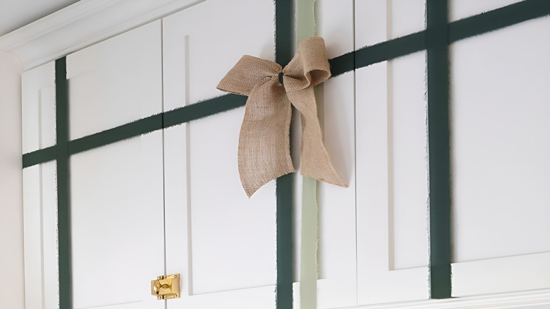 Red bow on blue dresser drawer