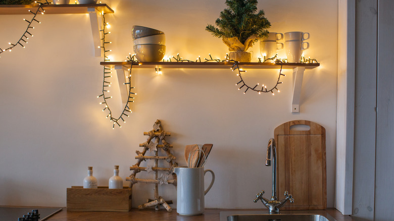 Christmas lights on kitchen shelves