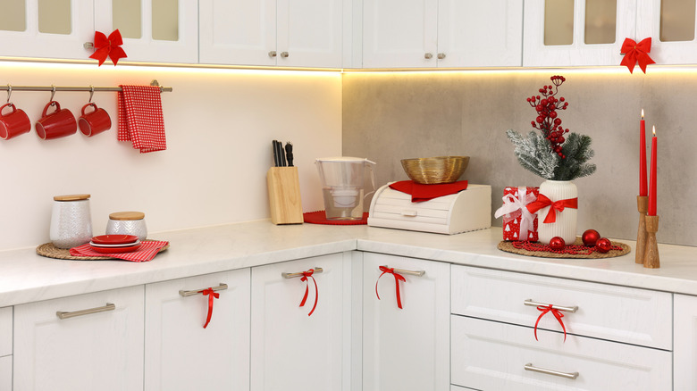 A kitchen with coordinated red Christmas decor