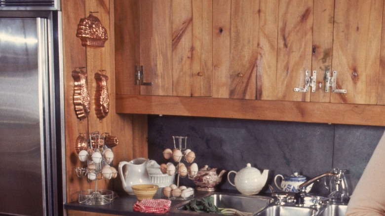 Cake pans mounted on wall as decor