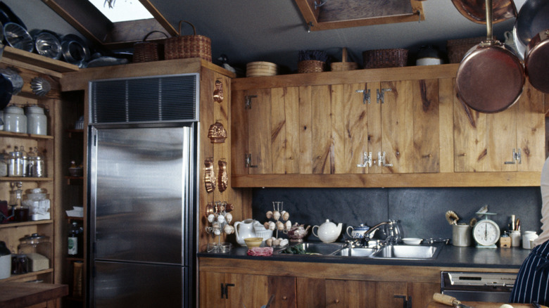 Plank wood cabinet doors in 70s kitchen