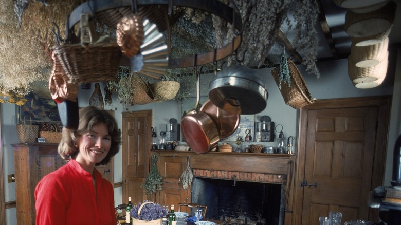 Ceiling pot holder with pots and hanging wicker baskets