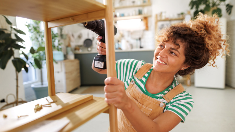 Woman making a DIY shelf