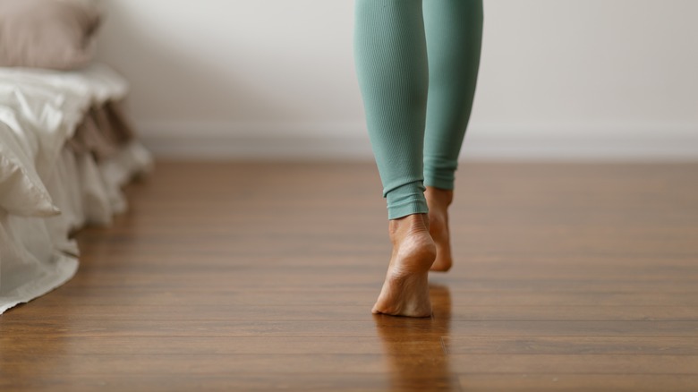 Person walking on a wood floor