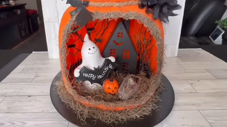 Two lower sections of a stack of pumpkin dioramas