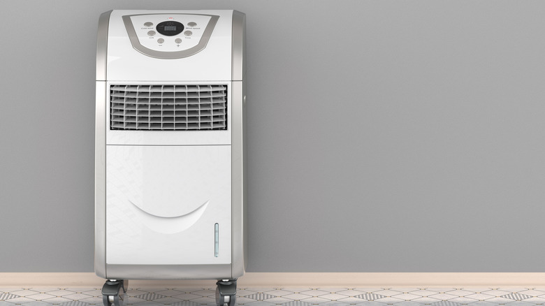 Man shopping for various air conditioner models