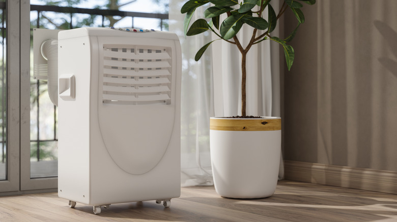 Portable air conditioner being vented outdoors