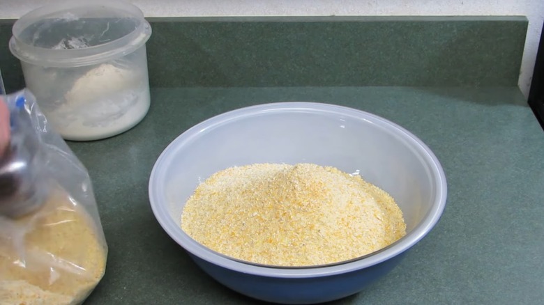 Man adding powdered cornmeal to a bowl