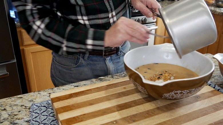 Man mixing suet batter in his kitchen