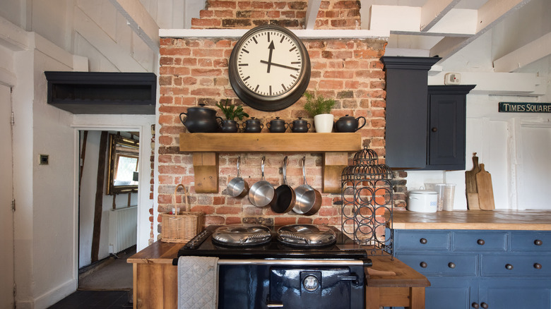 A brick feature around kitchen stove area.