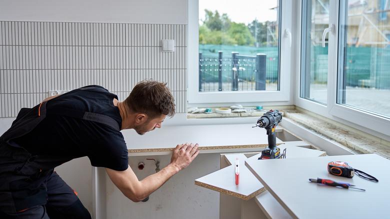 Man installing new countertop