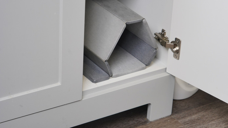 Open cabinet door showcasing hinge