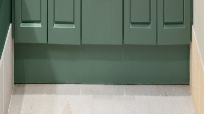 Sage green bathroom cabinets