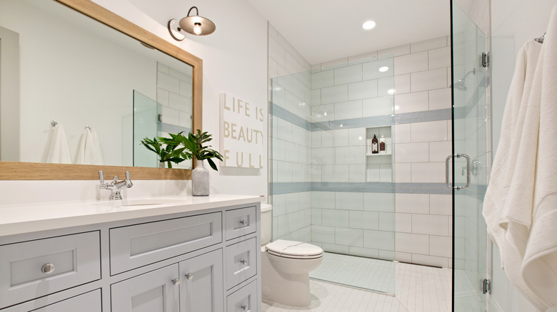 Mirror framed in wood in modern bathroom