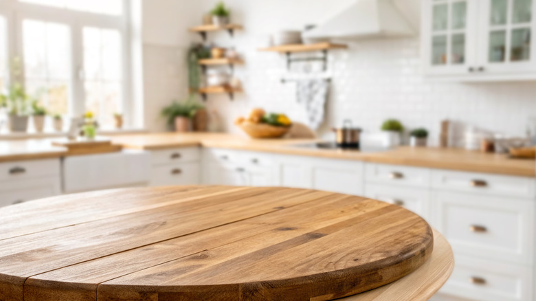 Wooden kitchen table with wooden countertops in background
