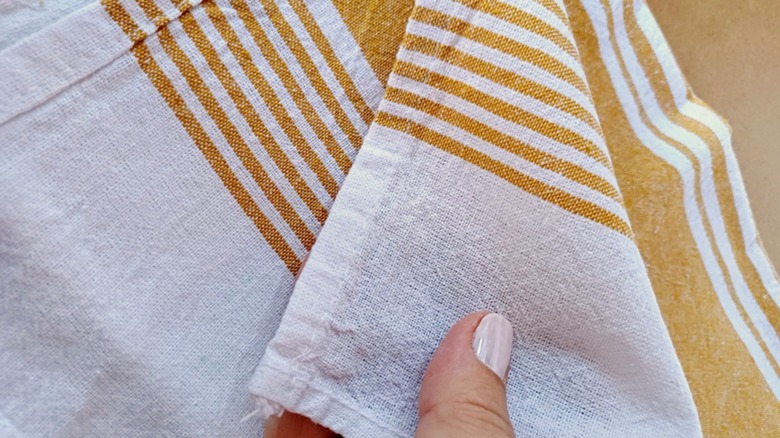 White and orange striped natural textile kitchen towel