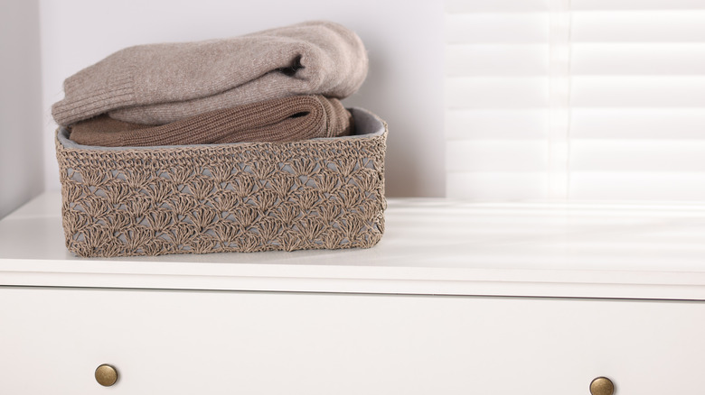 sweaters in a basket