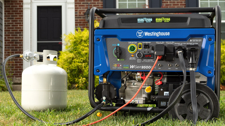Westinghouse WGen9500DFc with propane tank in front of house