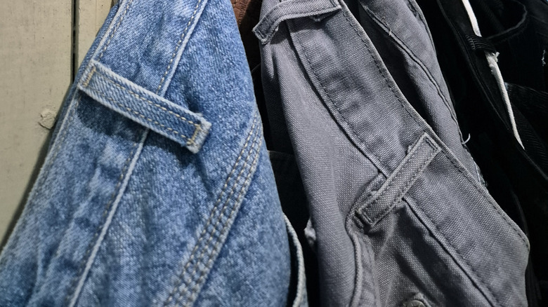 Jeans hanging on back of door